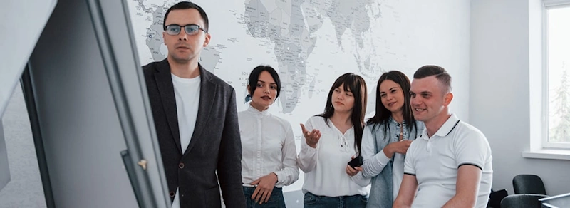 A professional team discussing options for business tradelines for sale.